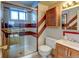 Bathroom featuring glass shower, vanity, white tiles, and geometric pattern at 315 E 112Th Dr, Northglenn, CO 80233