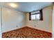 Bedroom with light walls, light carpet, and one window with dark curtains at 315 E 112Th Dr, Northglenn, CO 80233