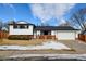 Charming two-story home featuring a well-maintained lawn, brick accents, and an attached two-car garage at 315 E 112Th Dr, Northglenn, CO 80233