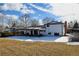 Back exterior view of home showcasing the yard with a covered patio at 315 E 112Th Dr, Northglenn, CO 80233