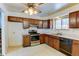 Functional kitchen featuring an oven, wood cabinets, and plenty of counter space at 315 E 112Th Dr, Northglenn, CO 80233