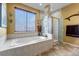 Relaxing bathroom with soaking tub and walk-in shower at 6460 E 165Th Ct, Brighton, CO 80602