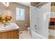 Clean bathroom with shower/tub combo and double vanity at 6460 E 165Th Ct, Brighton, CO 80602