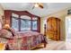 Main bedroom with a king-size bed and wood dresser at 6460 E 165Th Ct, Brighton, CO 80602