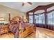 Spacious main bedroom with wood flooring and large windows at 6460 E 165Th Ct, Brighton, CO 80602