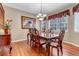 Elegant dining room with hardwood floors and a beautiful wood table at 6460 E 165Th Ct, Brighton, CO 80602