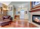 Bright entryway with hardwood floors and a view into the living room at 6460 E 165Th Ct, Brighton, CO 80602