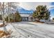 House exterior with snowy yard, showcasing its curb appeal in winter at 6460 E 165Th Ct, Brighton, CO 80602