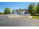 House exterior showcasing a side view, neat landscaping, and a white fence at 6460 E 165Th Ct, Brighton, CO 80602