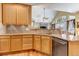 Open kitchen with granite countertops and stainless steel appliances at 6460 E 165Th Ct, Brighton, CO 80602