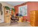 Home office with wood desk, chair and built-in shelving at 6460 E 165Th Ct, Brighton, CO 80602