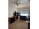 Bedroom with furniture, ceiling fan and a window bringing natural light at 4827 S Lewis Ct, Littleton, CO 80127