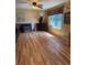 Bright living room with hardwood floors, a ceiling fan, and lots of natural light at 4827 S Lewis Ct, Littleton, CO 80127