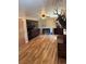 Cozy living room with hardwood floors, fireplace, fan and decorative animal heads on the wall at 4827 S Lewis Ct, Littleton, CO 80127