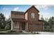 Two-story house with brown siding, attached garage, and landscaping at 7327 S Yank Ct, Littleton, CO 80123