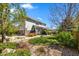 Landscaped backyard with a covered patio and healthy trees at 24394 E Dorado Pl, Aurora, CO 80016