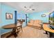 Bedroom features bright blue walls, a desk, a couch, and a ceiling fan at 24394 E Dorado Pl, Aurora, CO 80016