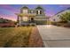 Charming two-story home with a welcoming porch and manicured front yard at 24394 E Dorado Pl, Aurora, CO 80016