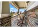 Charming front porch with rocking chairs and stone accents at 24394 E Dorado Pl, Aurora, CO 80016