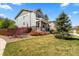 Well-landscaped front yard with vibrant bushes and a charming covered porch at 24394 E Dorado Pl, Aurora, CO 80016