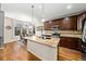 Modern kitchen with stainless appliances, eat-in island and hardwood floors at 24394 E Dorado Pl, Aurora, CO 80016