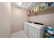 Bright laundry room with shelving, and modern washer and dryer at 24394 E Dorado Pl, Aurora, CO 80016