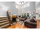 Spacious living room with a fireplace, hardwood floors, and tall ceilings at 24394 E Dorado Pl, Aurora, CO 80016