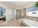 Bright main bathroom featuring glass enclosed shower, soaking tub, and double vanity at 24394 E Dorado Pl, Aurora, CO 80016