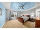 Spacious main bedroom features tray ceiling, fan, and large windows overlooking the backyard at 24394 E Dorado Pl, Aurora, CO 80016