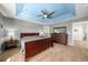 Spacious main bedroom features tray ceiling, fan, and large windows overlooking the backyard at 24394 E Dorado Pl, Aurora, CO 80016