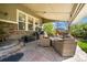 Cozy covered patio with comfortable seating and an outdoor grill area at 24394 E Dorado Pl, Aurora, CO 80016