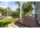 Backyard showcasing a wooden deck and a tranquil outdoor space at 4860 S Salida Ct, Aurora, CO 80015