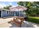 Inviting backyard with a picnic table and large patio umbrella for outdoor entertaining at 4860 S Salida Ct, Aurora, CO 80015