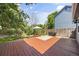 Spacious backyard featuring a wooden deck, patio, and lush lawn at 4860 S Salida Ct, Aurora, CO 80015