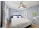 Bedroom featuring a ceiling fan, an ornamental wall hanging, and a view to an ensuite bathroom at 4860 S Salida Ct, Aurora, CO 80015