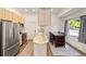 Bright and modern kitchen with stainless steel appliances, ample counter space, and a dining area at 4860 S Salida Ct, Aurora, CO 80015