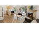Open-concept floorplan with a fireplace, living room, kitchen, and dining room at 4860 S Salida Ct, Aurora, CO 80015