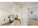 Second story staircase landing with fireplace and view into bedroom at 4860 S Salida Ct, Aurora, CO 80015