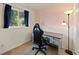 Office space with a gaming chair, a desk, and a large window overlooking the yard at 4860 S Salida Ct, Aurora, CO 80015
