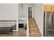 Staircase that leads to the second floor, with a view of the living room and kitchen at 4860 S Salida Ct, Aurora, CO 80015