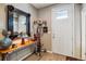 Foyer with decorative mirror, console table, and a stylish chandelier at 8157 E 53Rd Dr, Denver, CO 80238