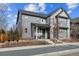 Exterior of two story house featuring tidy landscaping, neutral paint and covered porch at 8157 E 53Rd Dr, Denver, CO 80238