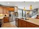 Gourmet kitchen featuring stainless appliances, granite counters and center island sink at 8157 E 53Rd Dr, Denver, CO 80238