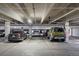 Interior of parking garage with multiple cars parked at 1898 S Bannock St # 103, Denver, CO 80223