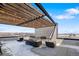 Roof deck showcasing fireplace and city views at 1898 S Bannock St # 103, Denver, CO 80223