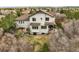Aerial view of the back of the house showing the patio and backyard at 947 Buffalo Ridge Rd, Castle Pines, CO 80108