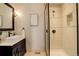 Modern bathroom with a walk-in shower, stylish vanity, and contemporary finishes at 947 Buffalo Ridge Rd, Castle Pines, CO 80108