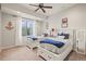 Bright bedroom with two twin beds, large window, and nautical-themed decor at 947 Buffalo Ridge Rd, Castle Pines, CO 80108