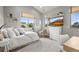 Inviting bedroom featuring large windows, a TV, and a comfortable seating area at 947 Buffalo Ridge Rd, Castle Pines, CO 80108