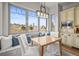 Cozy breakfast nook with large windows, bench seating, and lovely backyard views at 947 Buffalo Ridge Rd, Castle Pines, CO 80108